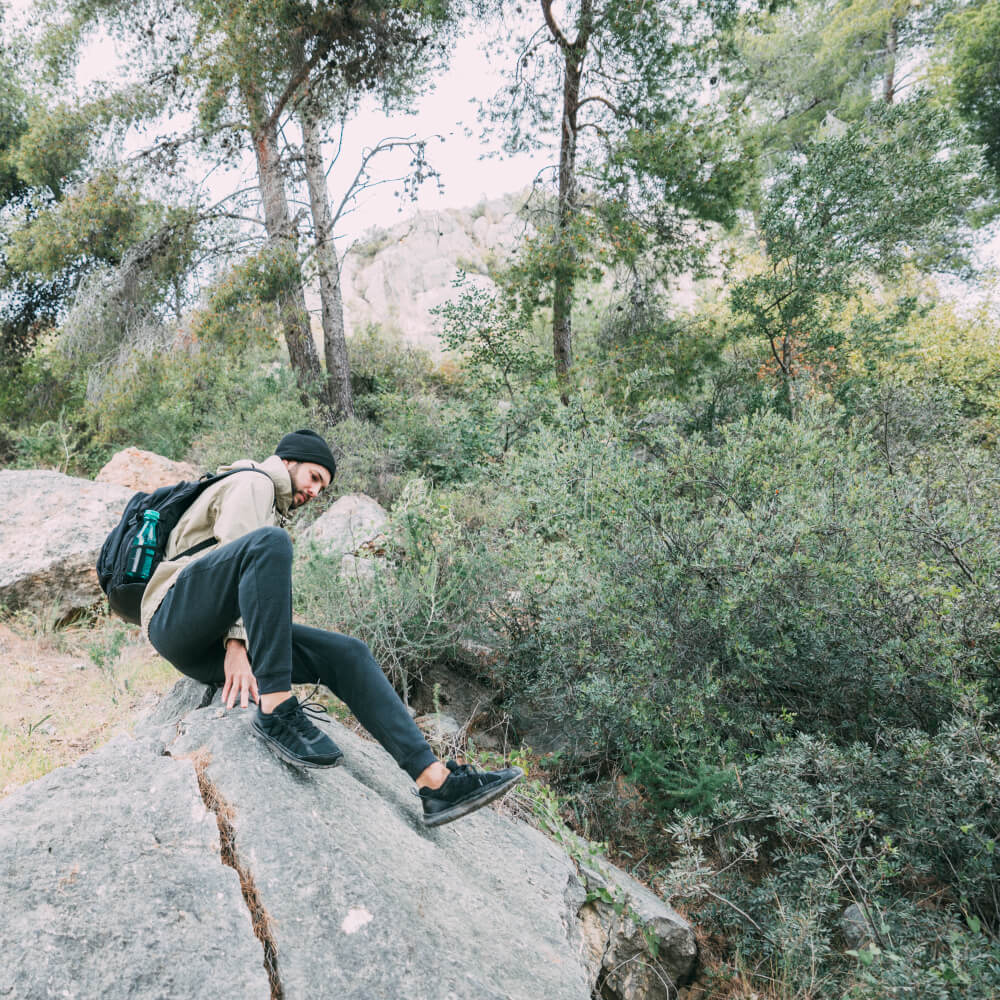 man-trekking-mountains