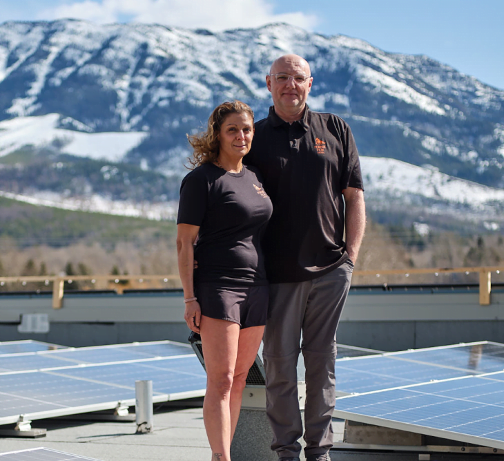 Fernie Fox Hotel owners Marina and Jeremiah Pauw next to their solar panel array