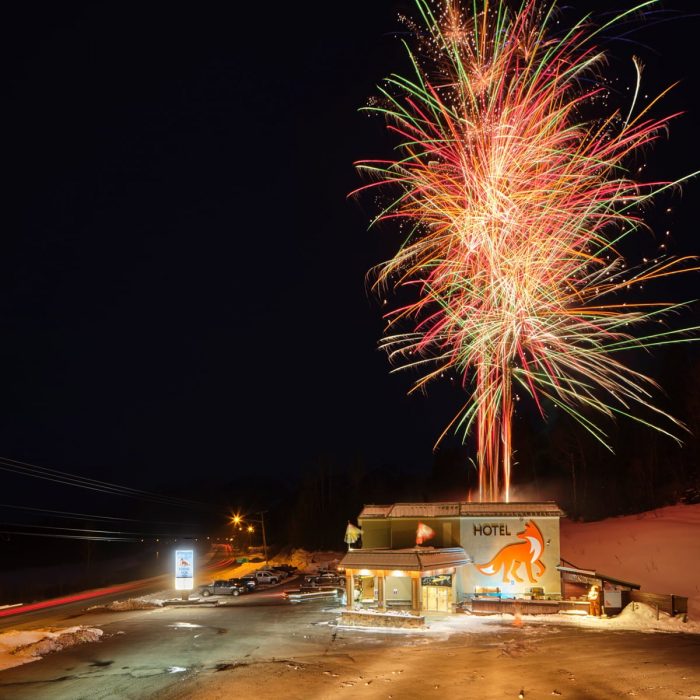 Fireworks being shot off the roof of the Fernie Fox Hotel to celebrate the hotel's rebrand as an accommodation provider in Fernie BC