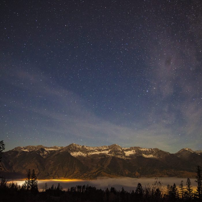 view of the lizard range and Fernie Alpine Resort with valley bottom fog.